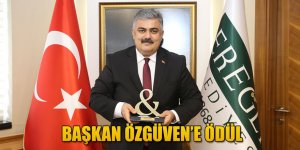 BAŞKAN ÖZGÜVEN’E ÖDÜL.