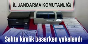 Sahte kimlik basarken yakalandı