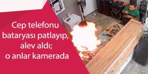 Tamire getirilen cep telefonu bataryası patlayıp, alev aldı; o anlar kamerada